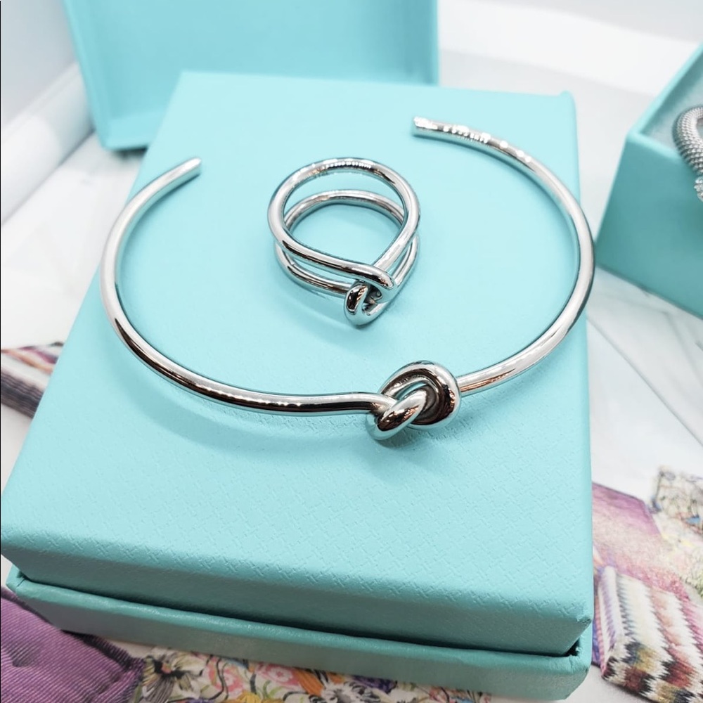 Stainless Steel 316L. Won’t fade or tarnish.  Silver or Gold